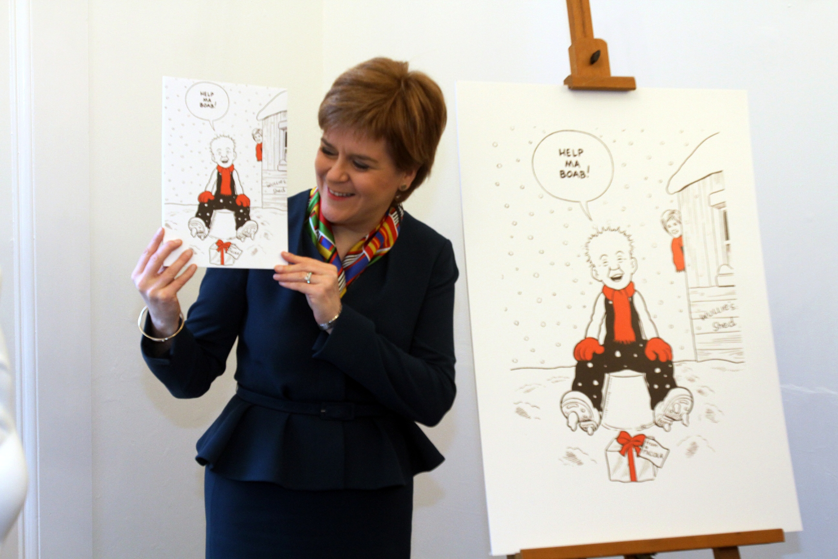 First Minister Nicola Sturgeon unveils her Oor Wullie Christmas card at The Vine in Dundee