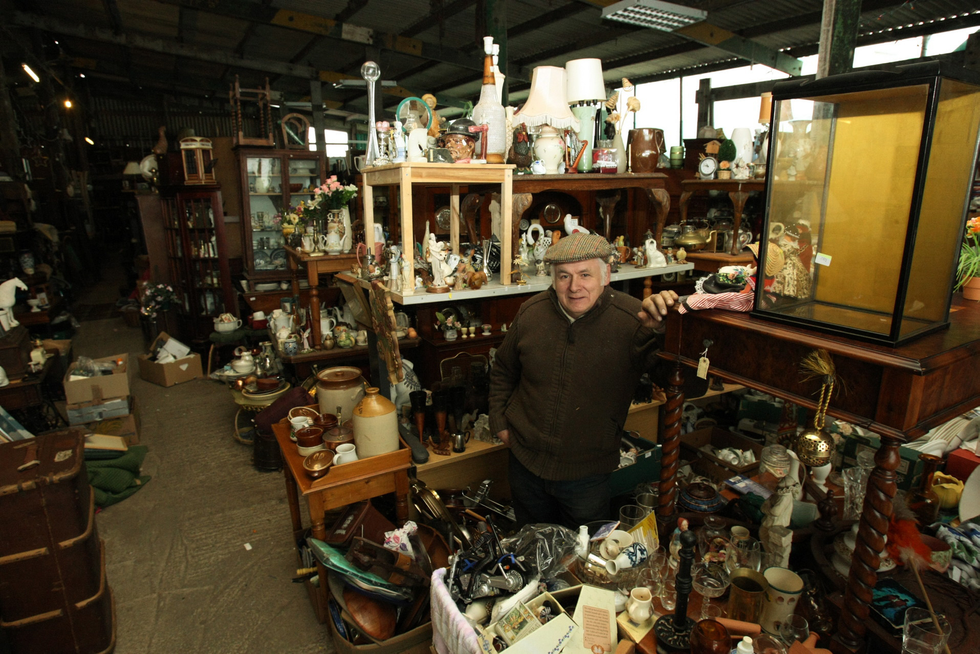 Peter Harrison beside a small part of his collection.