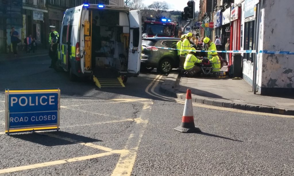 Car smashes into shop front in Perth, driver trapped