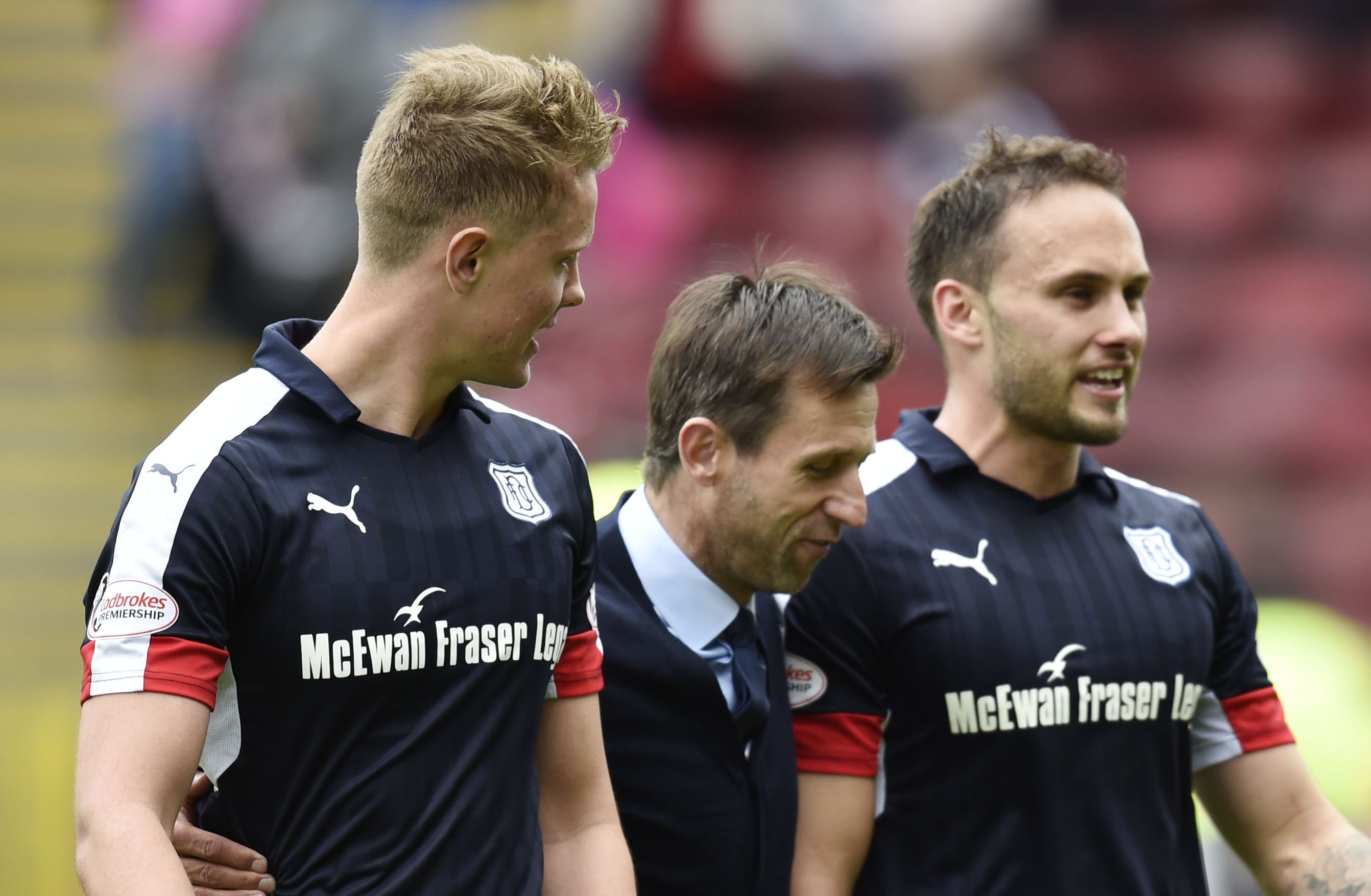 So far, so good. Dundee interim manager Neil McCann celebrates at full time with Mark O'Hara and Tom Hateley.