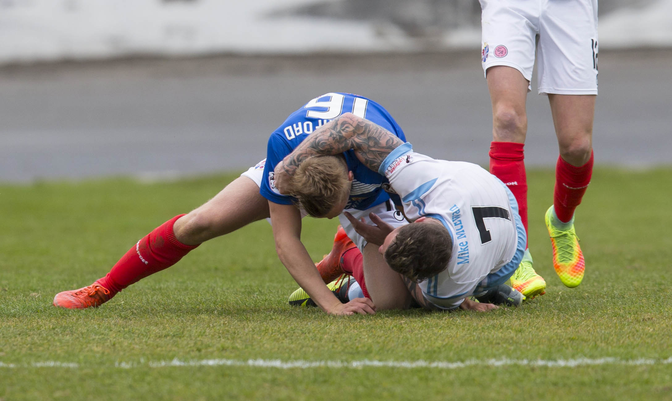 Cowdenbeath's Shaun Rutherford (16) clashes with David Cox.