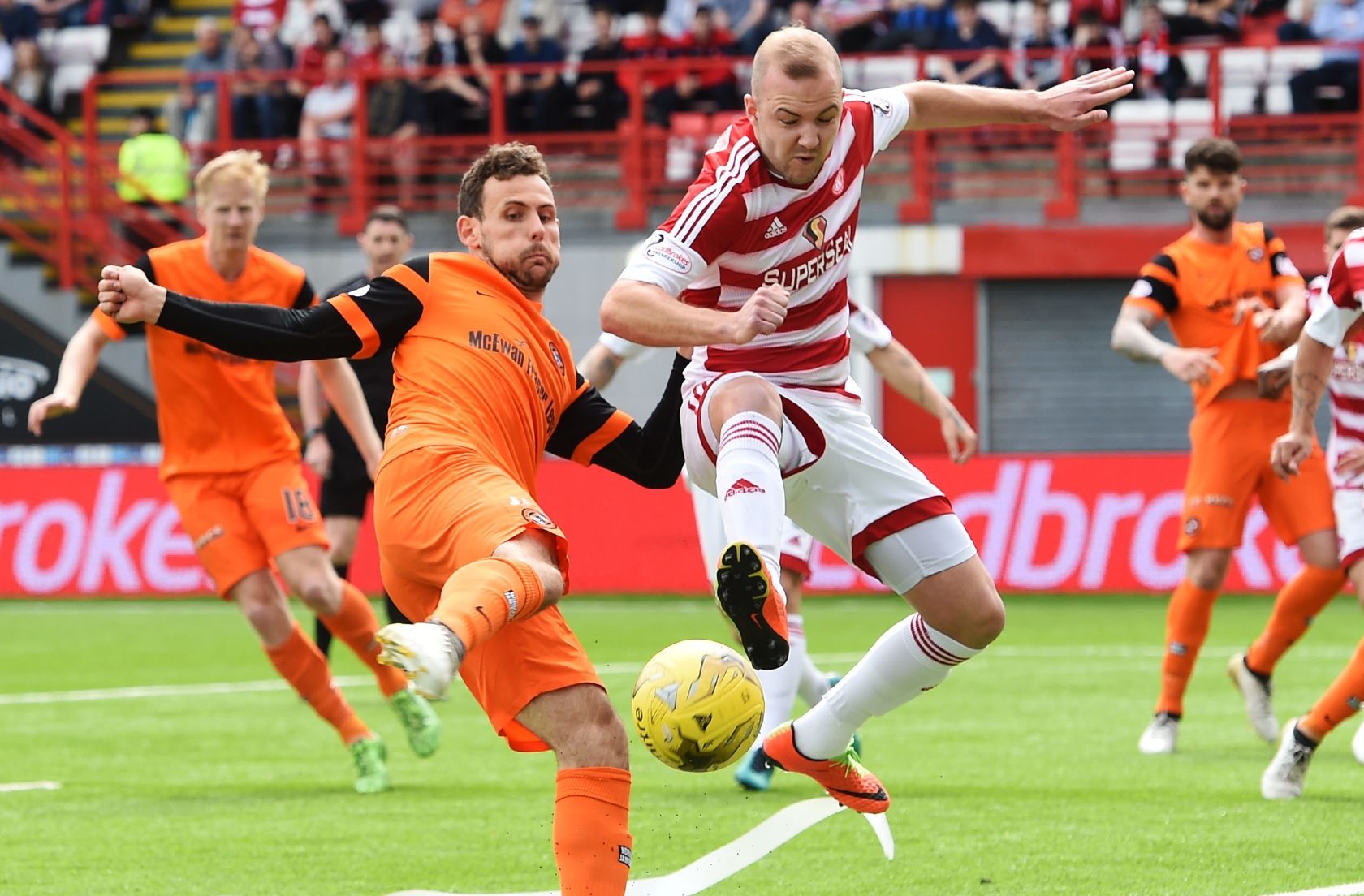 Tony Andreu tries to get a shot in for United.