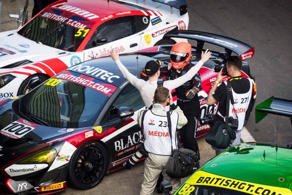 Haggerty greets teammate Mitchell in pit lane