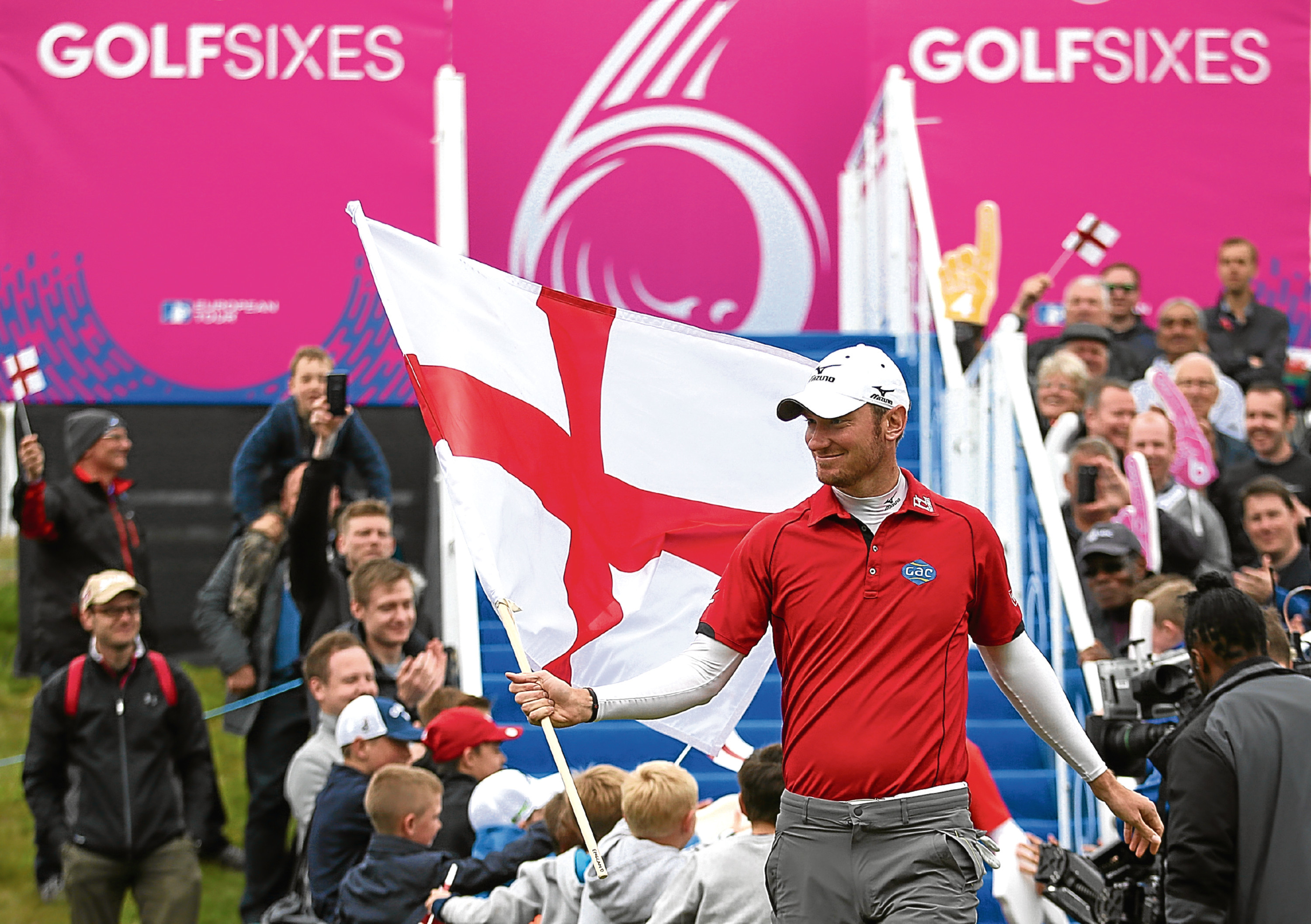 England's Chris Wood and Andy Sullivan make their entrance on the 1st hole during day one of the Golf Sixes at the Centurion Club, St Albans.