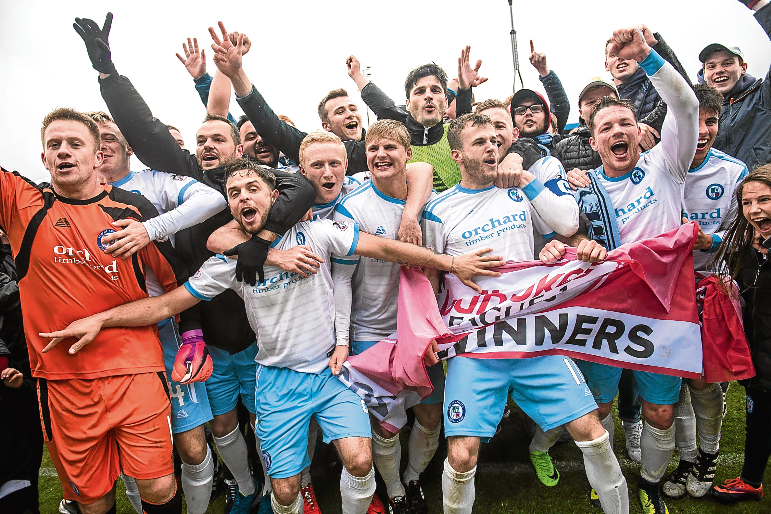 Forfar players celebrate promotion to Ladbrokes League 1.