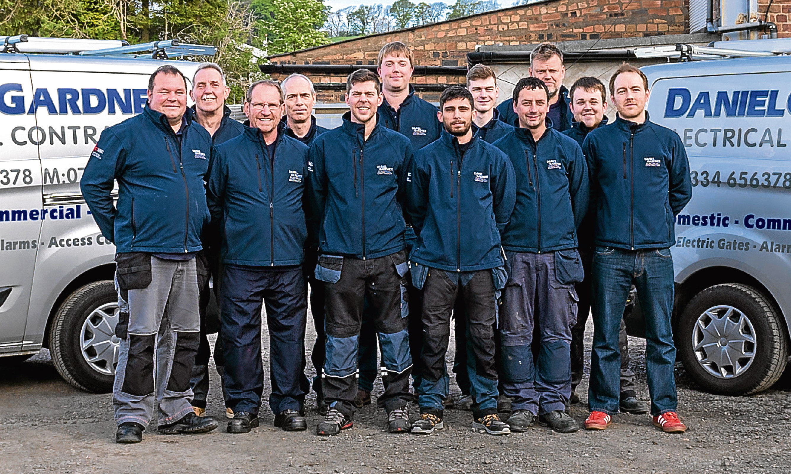 Daniel Gardner (centre, back) with members of his team