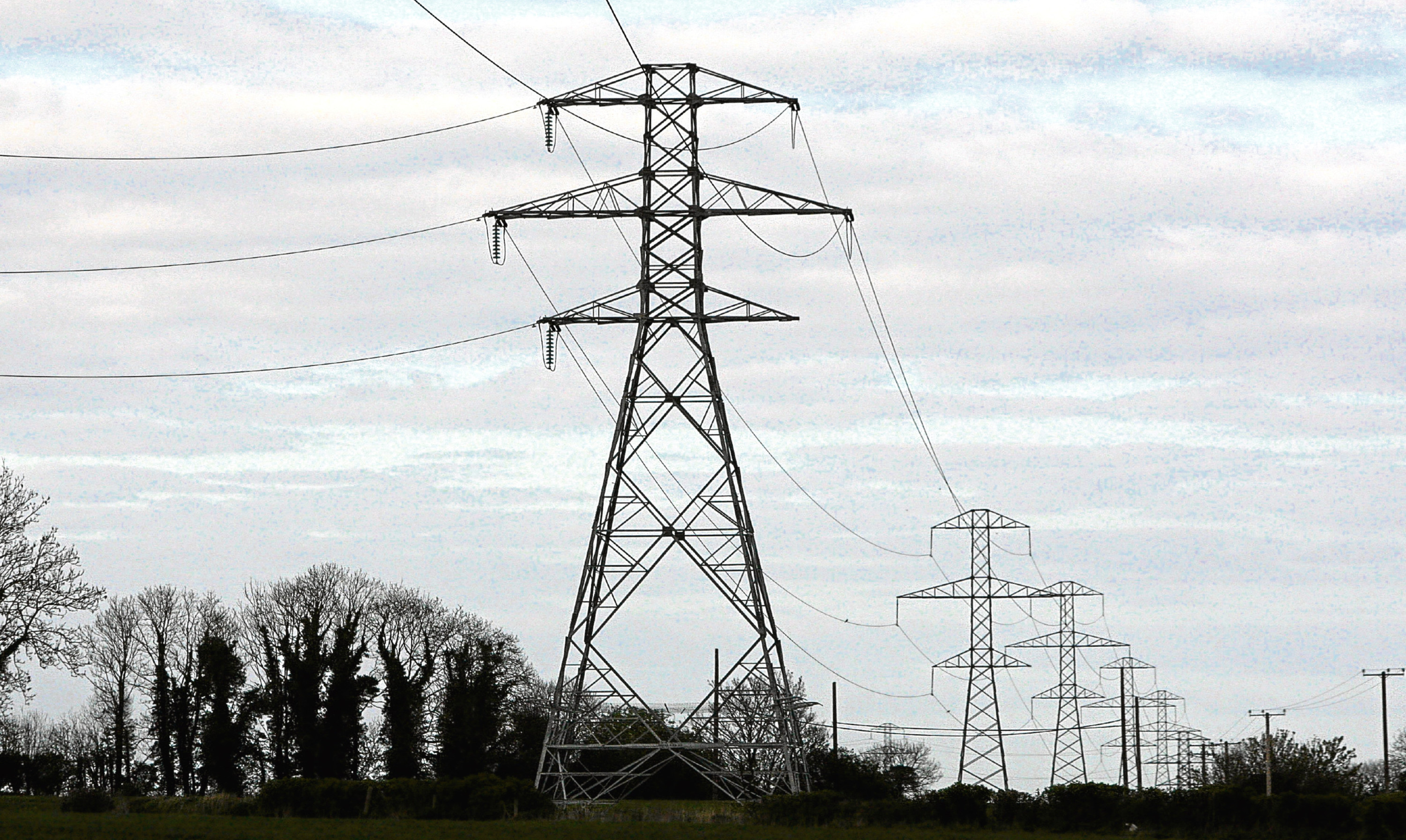 Electricity pylons carrying supplies from generators to consumers.