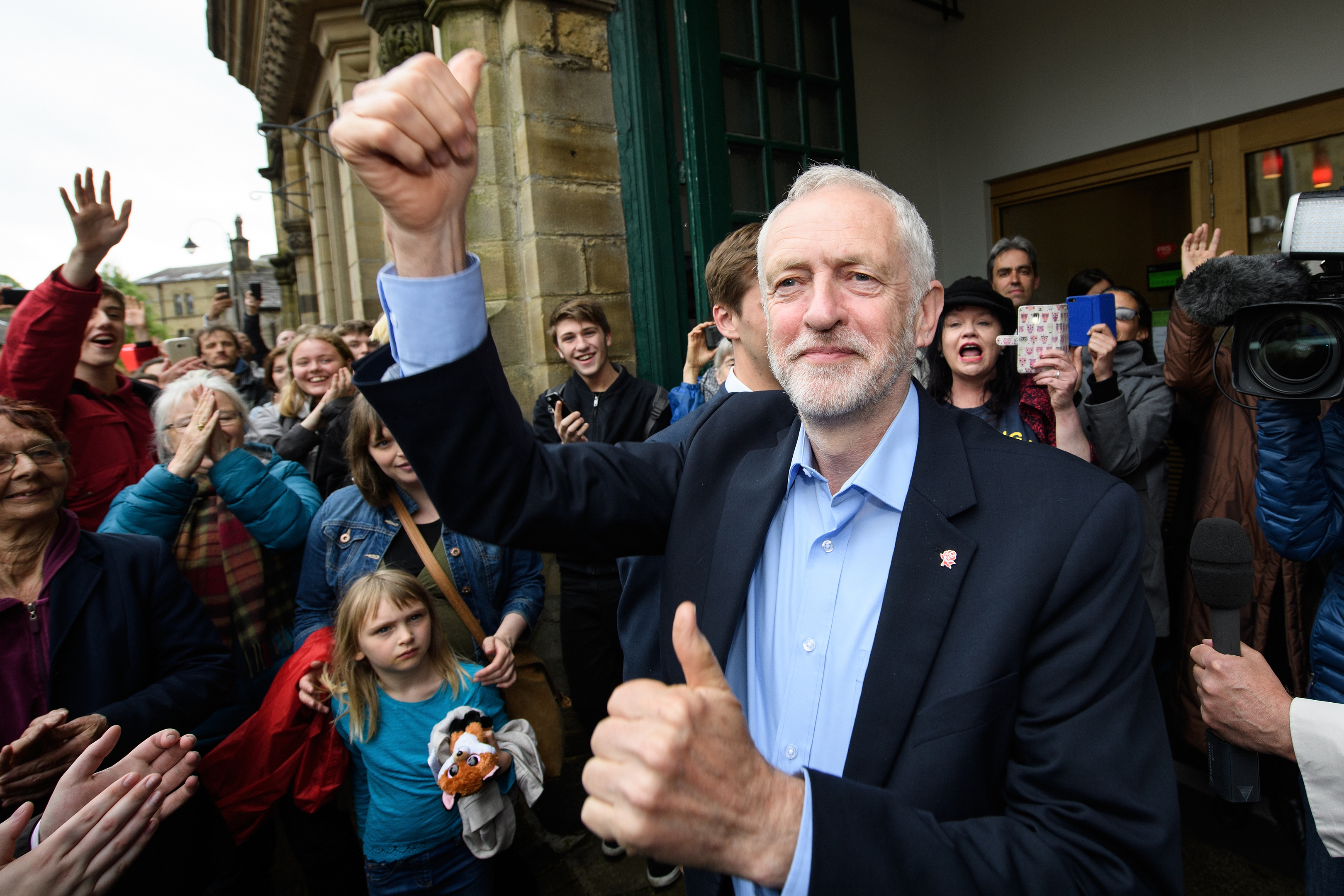 Jeremy Corbyn waves as he arrives before speaking to hundreds of people who attended an election rally on May 15, 2017 in Hebden Bridge.