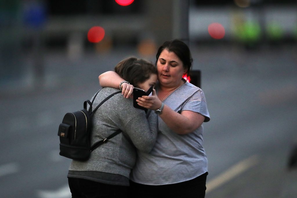Ariana Grande concert attendees Vikki Baker and her daughter Charlotte, aged 13, leave the Park Inn where they were given refuge after last night's explosion.