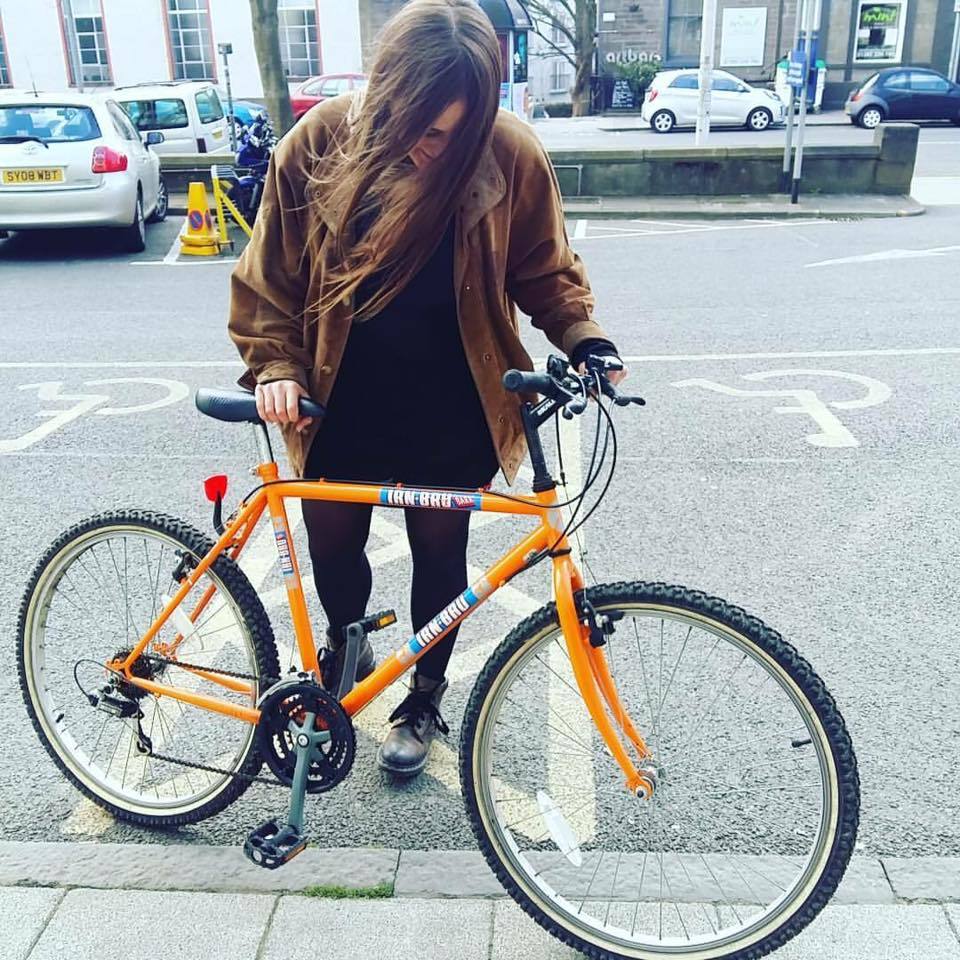 Abbie Lois Cartmell with her beloved Irn Bru bike before the theft.