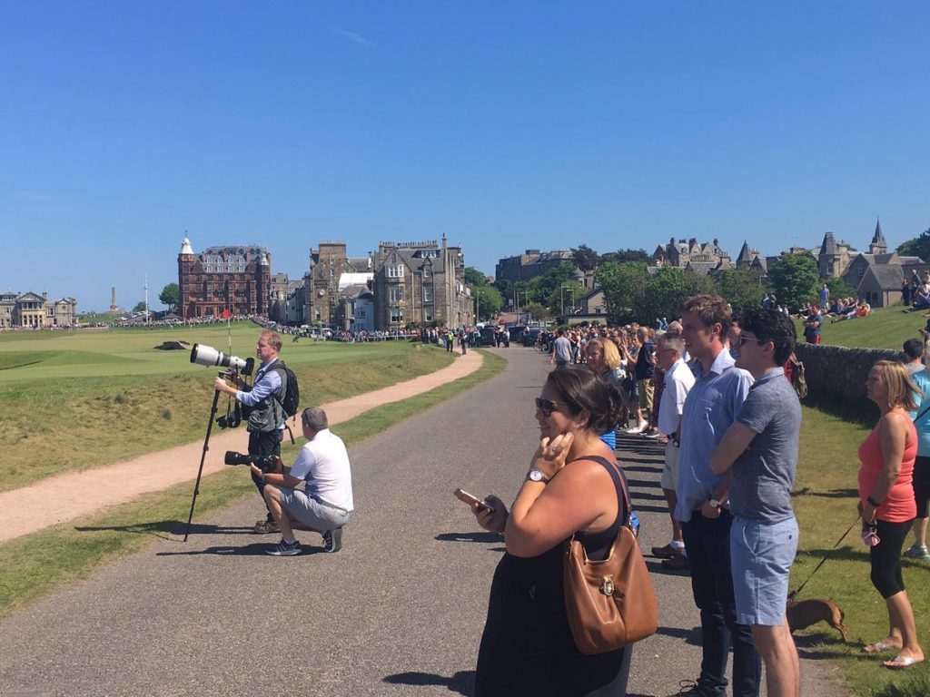 Crowds gather around the 18th hole of the old course at St Andrews as Obama plays.