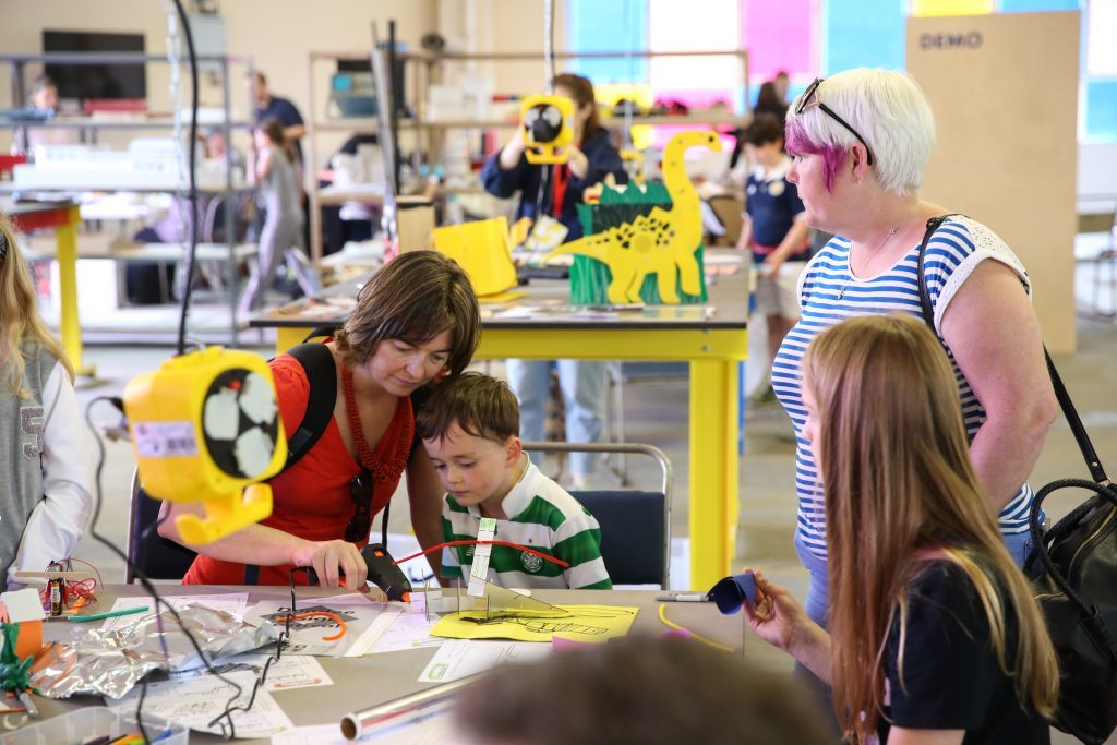 A family taking part in the Ardler Inventor Project workshop at the Dundee Design Festival.