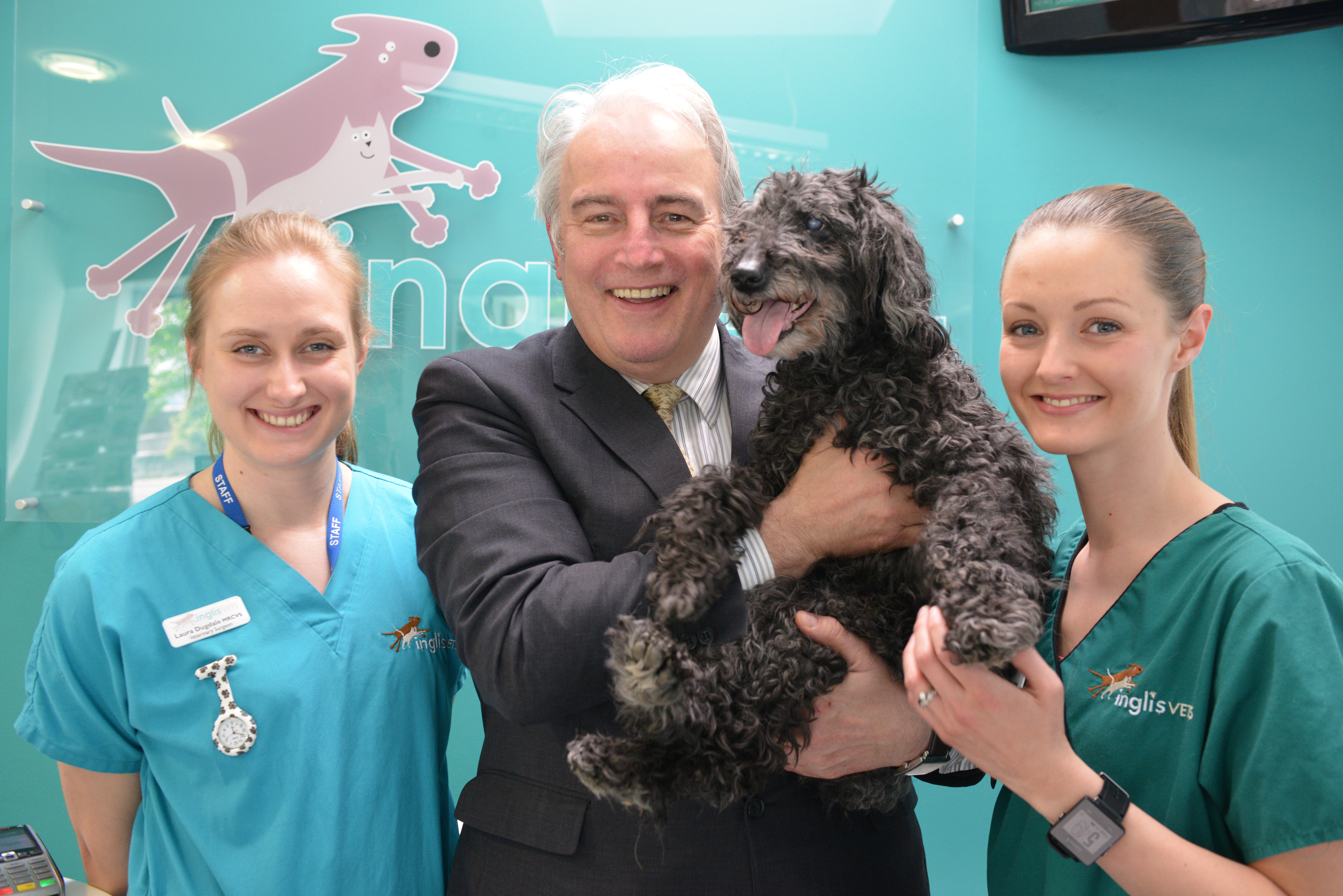 Vet Laura Dugdale,  Ian with his dog Taz and Martha McShane.