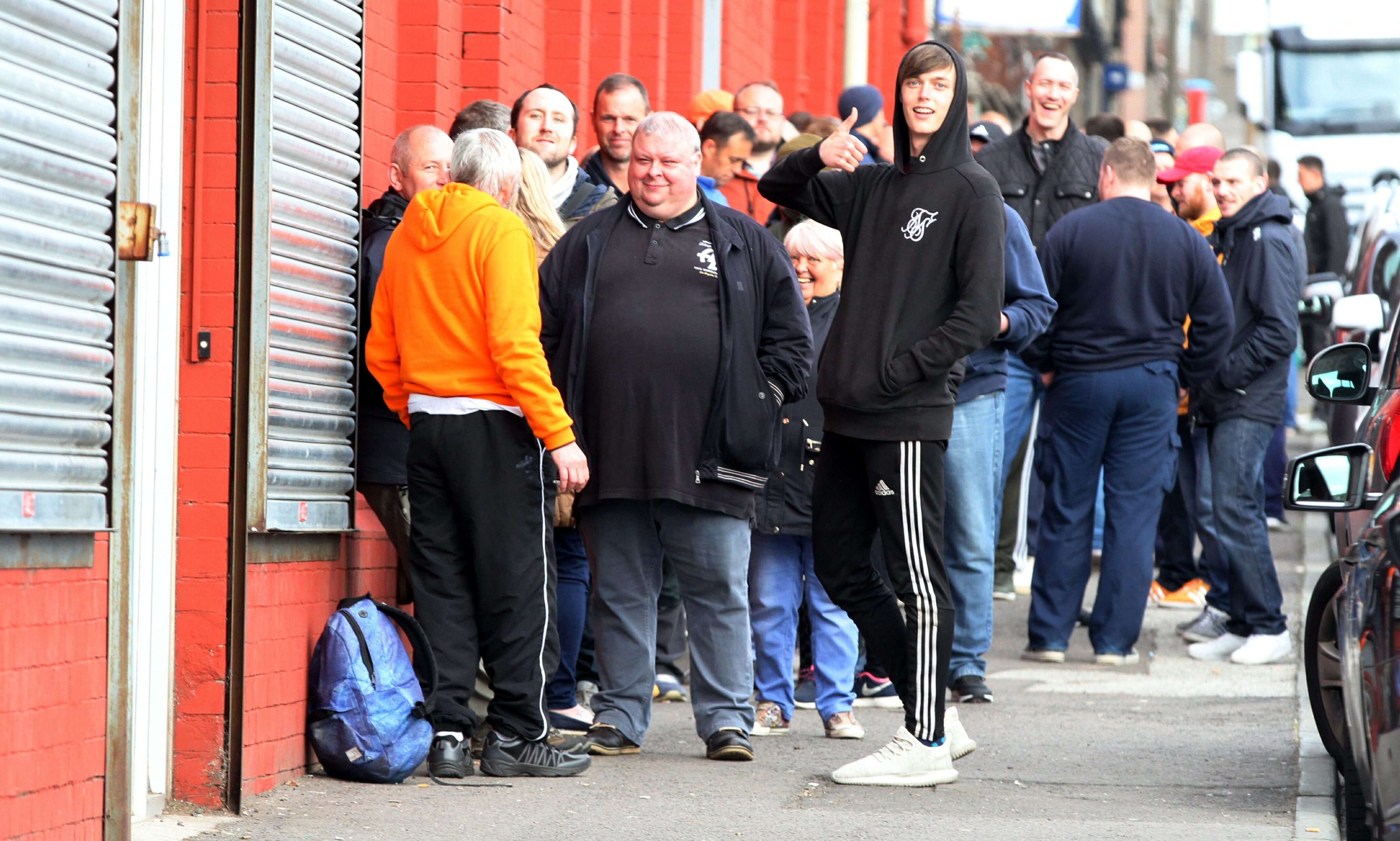 United fans waiting for the club shop to open for ticket sales.