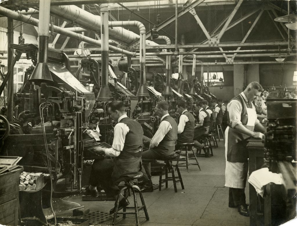 Men work away at the Linotype machines in the case room at Meadowside in 1937.