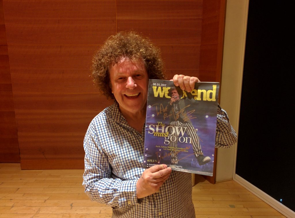 Leo Sayer reads up on his Courier weekend magazine ahead of his Perth gig.