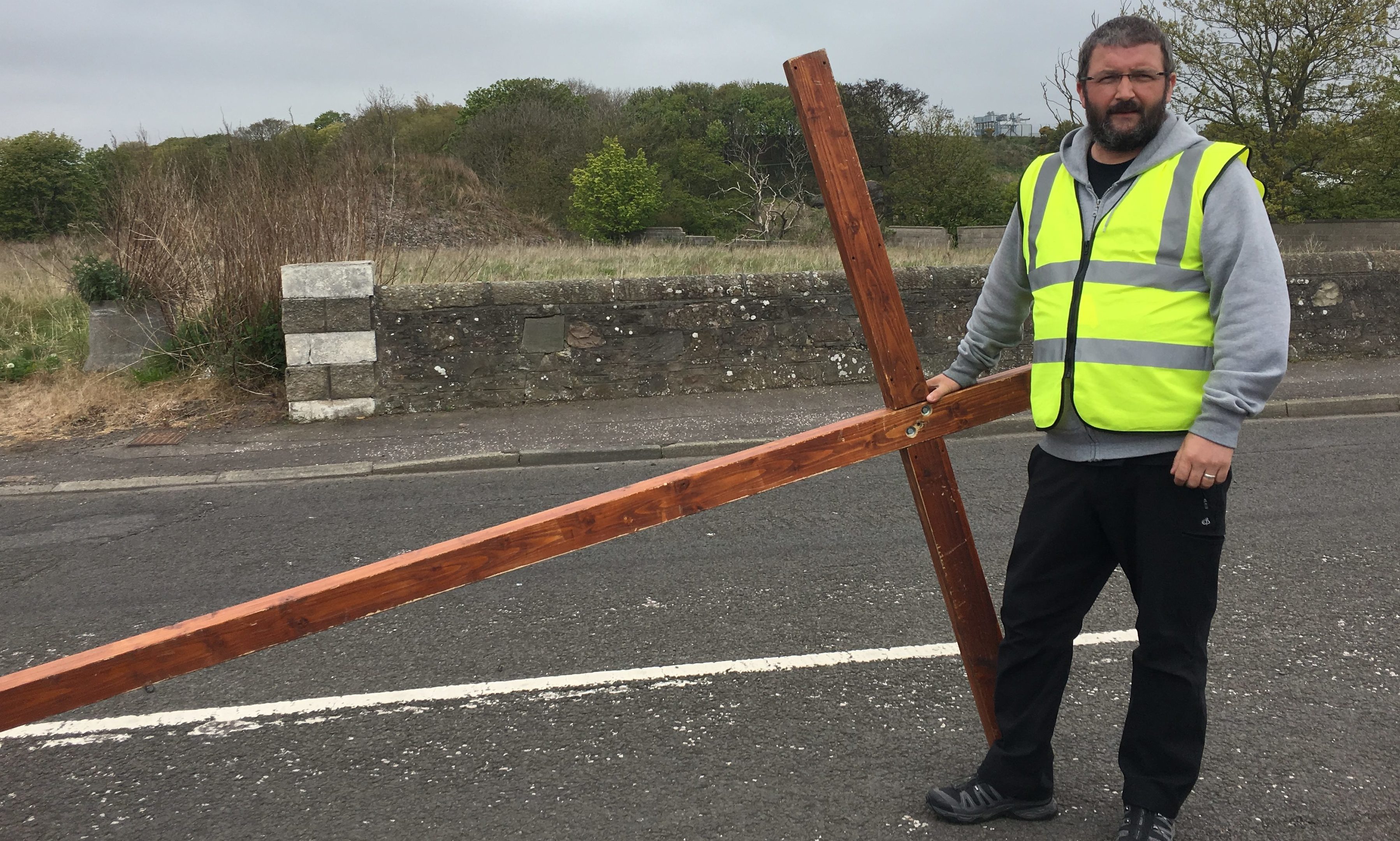 Gordon Cruden with the large cross which is being carried across Scotland