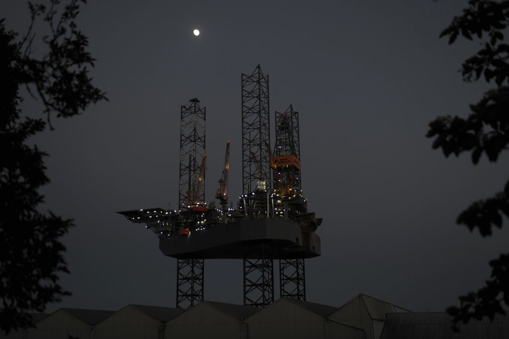 The moon above the rig in Dundee.