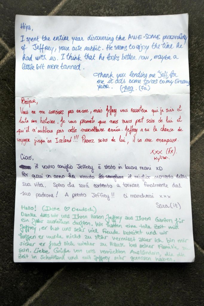 Courier News. Perth Story. Fiona McWilliams had her rabbit ornament stolen from her garden in Perth. A year later it was returned with a note in four languages indicating he had been travelling (including to Iceland). Picture shows; the letter that accompanied 'Geoffrey' back home in the garden. Wednesday, 10th May, 2017.