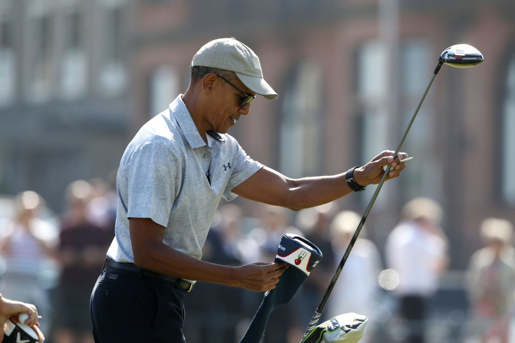 Barack Obama prepares to tee off at the first hole at St Andrews Golf Club.