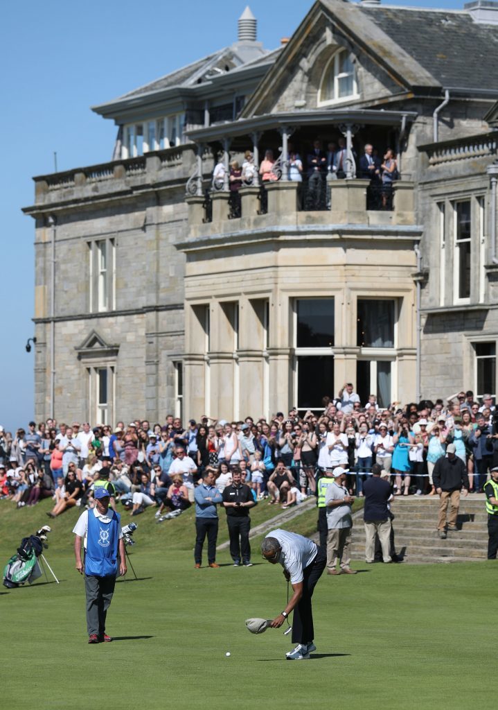 Crowds gather to watch former US president Barack Obama play golf.