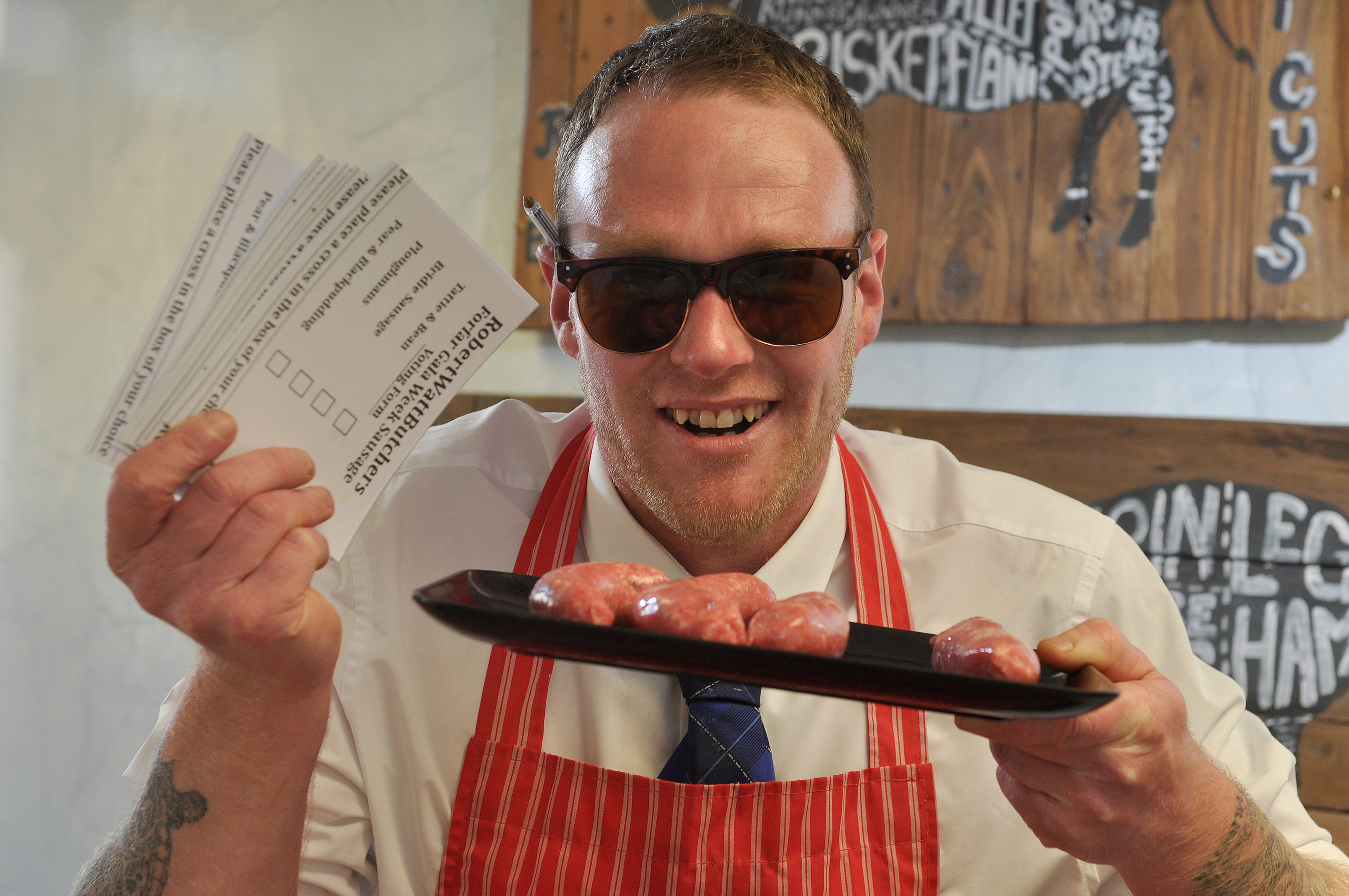 Kris Davidson with polling cards and some of the sausages