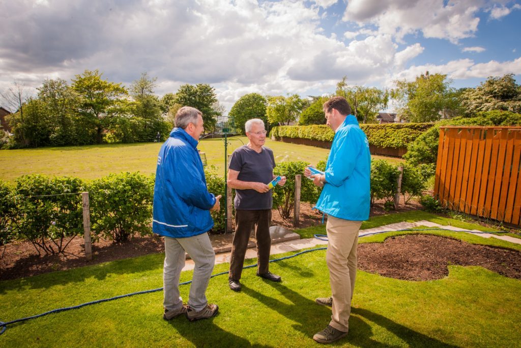 Councillor Angus Forbes and Ian Duncan chat to Inchture resident Brian Brogan.