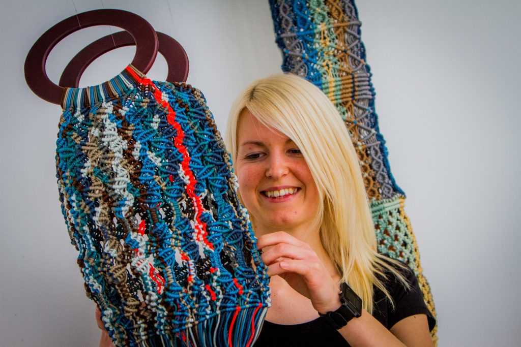 Sarah Watt and her textile piece called 'Knot on our Beach'.