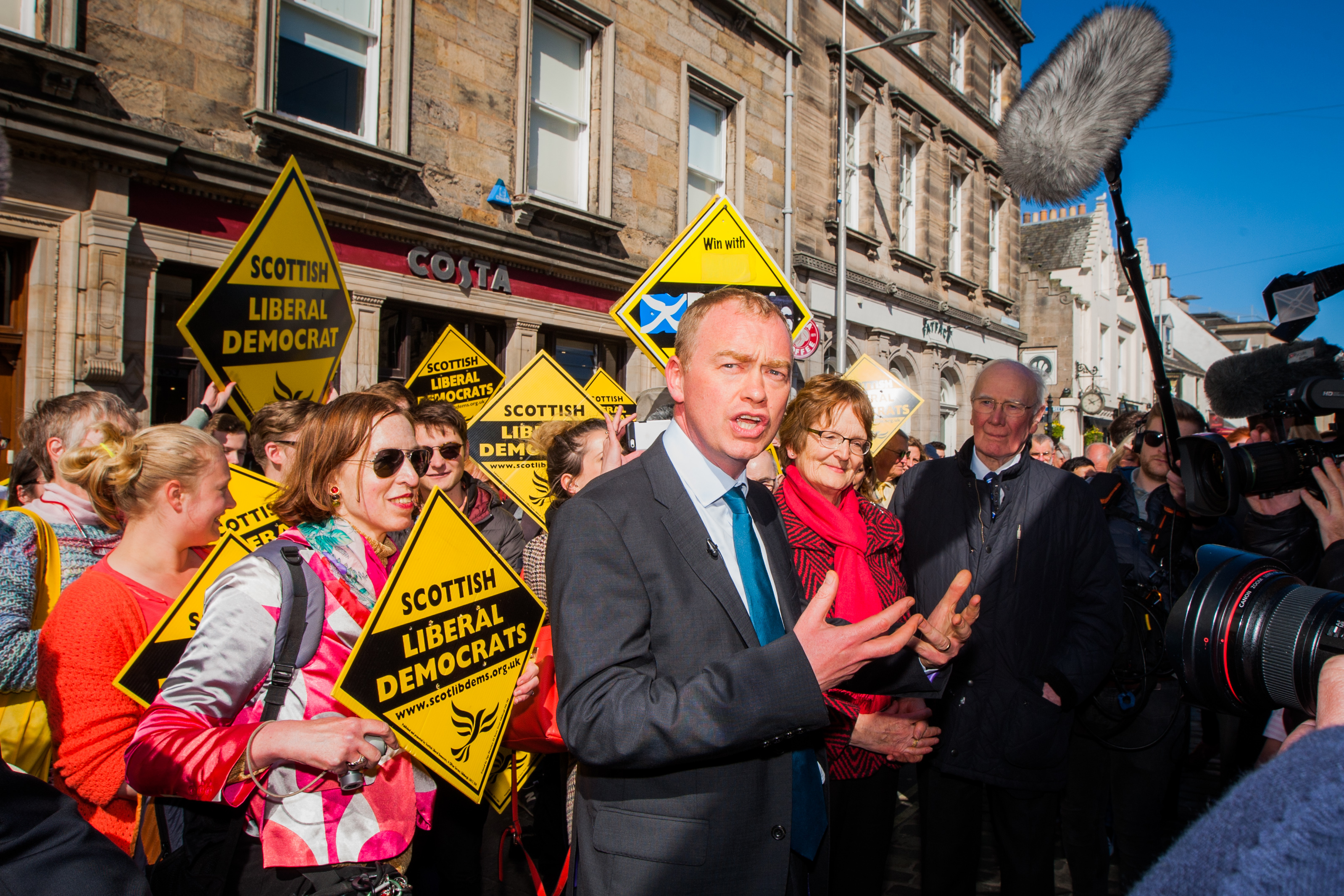 Tim Farron (front) alongside Elizabeth Richies and Sir Menzies Campbell in Market Street, St Andrews.