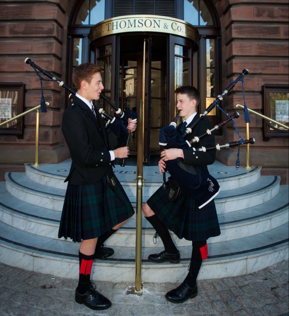 Pipers greeting the guests.