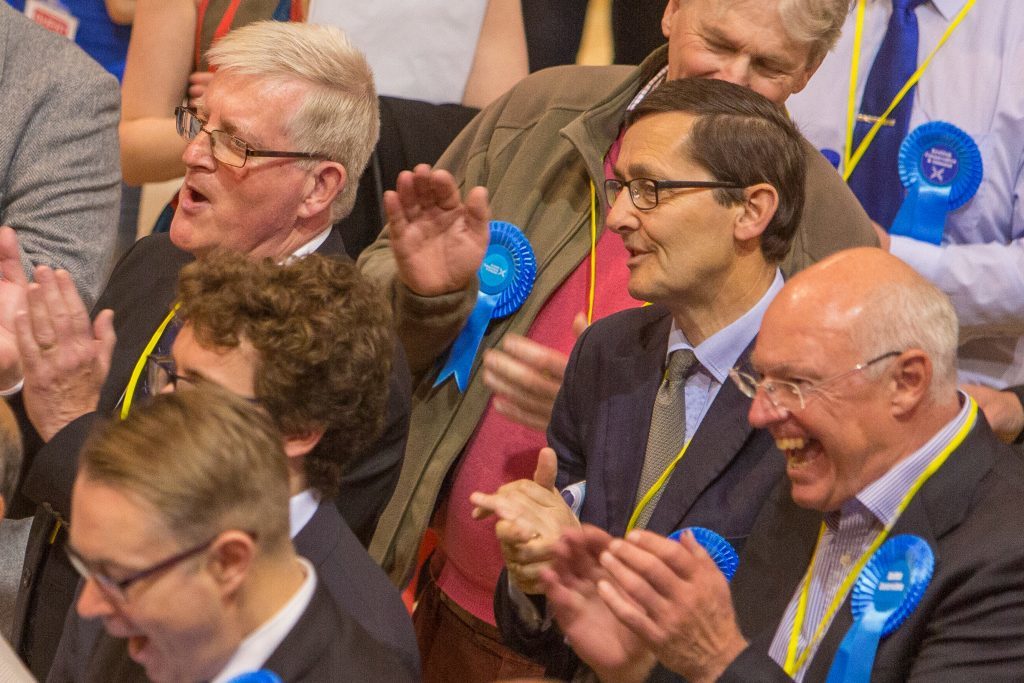 Conservative supporters applaud  at the Fife count.