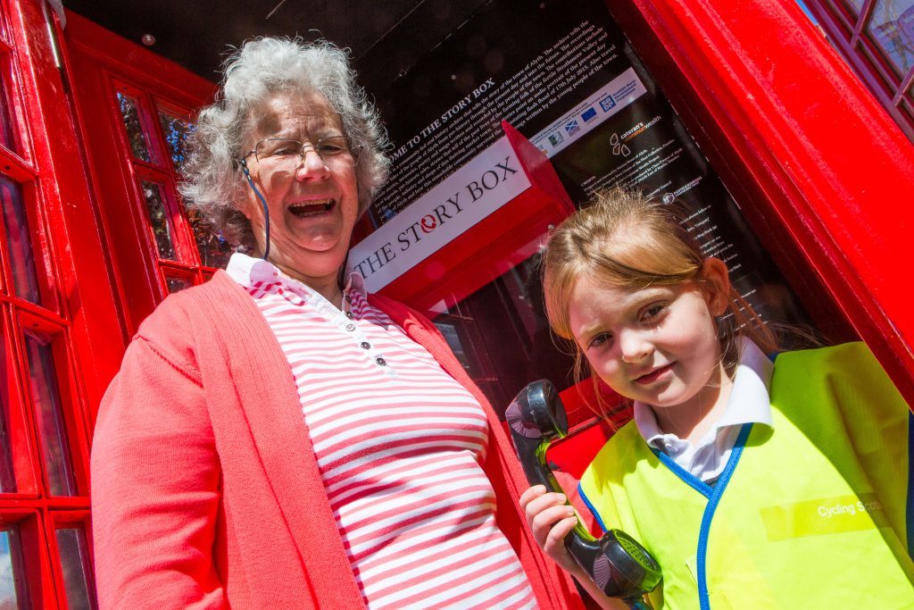 Dorothy Lothian and P1 Pupil Kamryn Burdass officially open The Story Box.