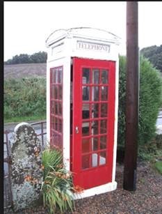 Scotland's oldest payphone still in use in Rhynd, Perthshire. Made from concrete rather than the usual cast iron, it is uniquely painted white and red.