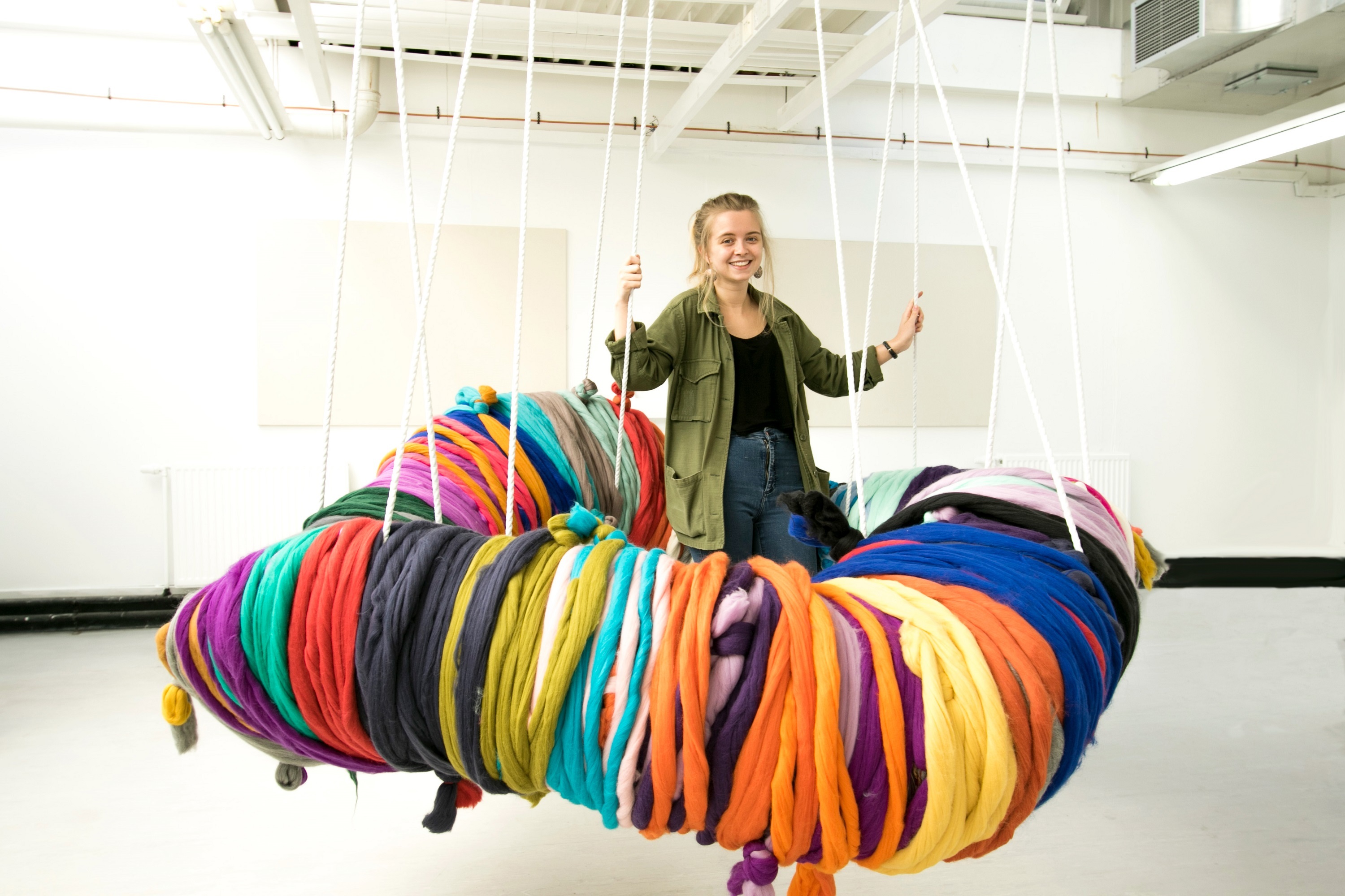 Shannon Murray with the giant pom-pom she is collaborating with the public on for her Degree Show exhibit.