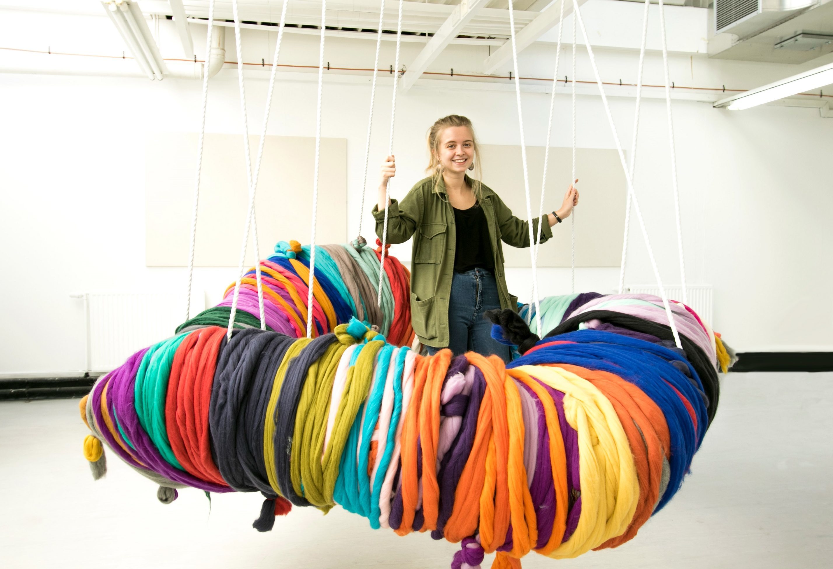 Shannon Murray with her giant pom-pom at this year's Dundee University degree show