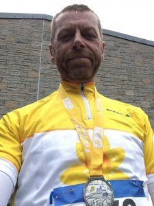 Ross MacCallum with his medal after completing the 81-mile route.