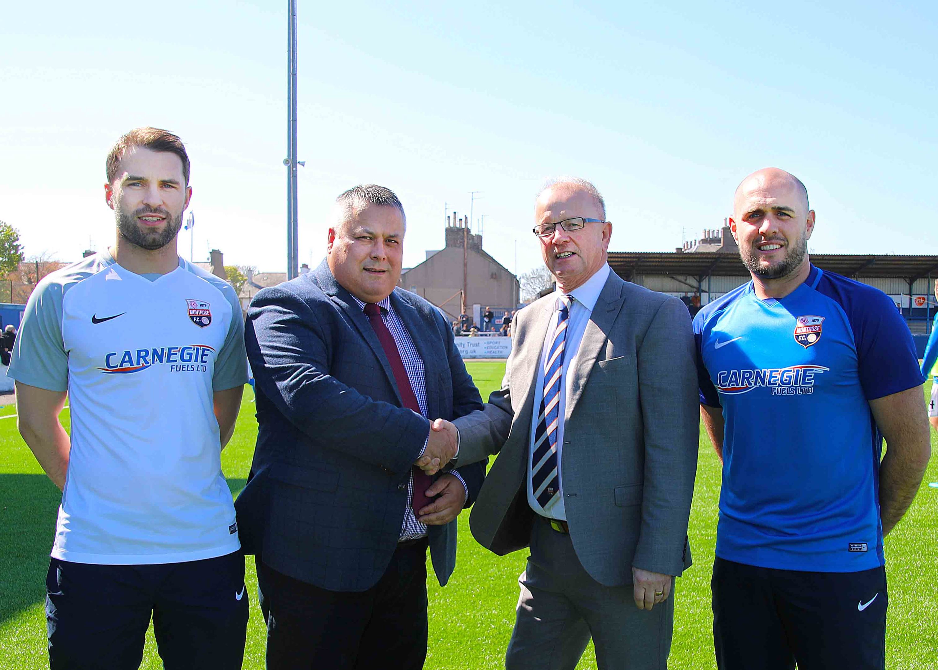 Kevin Carnegie, centre left with John Crawford, flanked by defenders Iain Campbell in the new blue home strip and Callum MacDonald in the new white away strip.