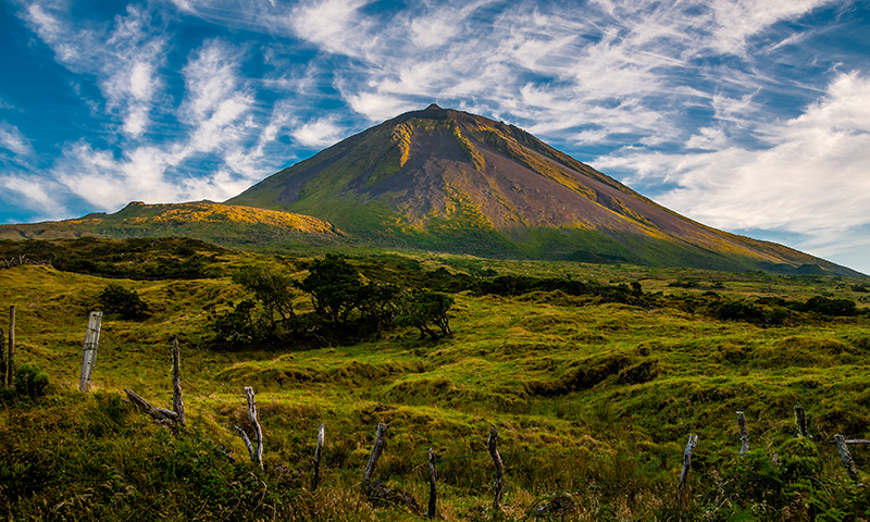 The warm coloured evening sun gracing the volcanic mount Pico on the island of Pico-Azores-Portugal.