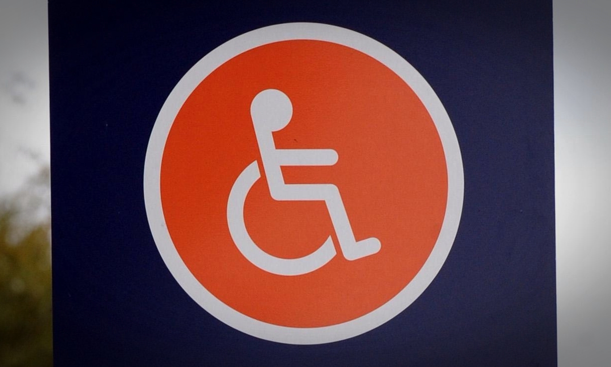 Disabled parking spaces sign at a Sainsburys store in London.