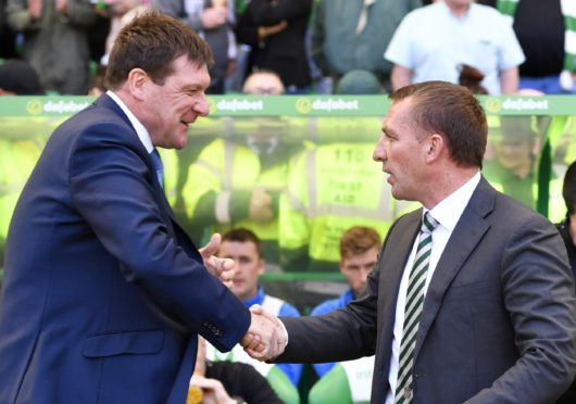 Tommy Wright greets fellow Northern Irishman Brendan Rodgers.