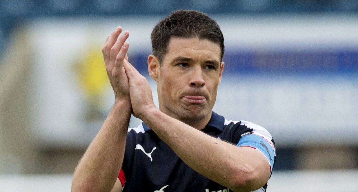 Darren O'Dea applauds the Dundee fans.