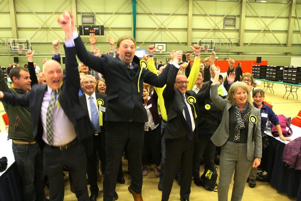 Chris Law and Stewart Hosie celebrate at the 2015 general election count. 