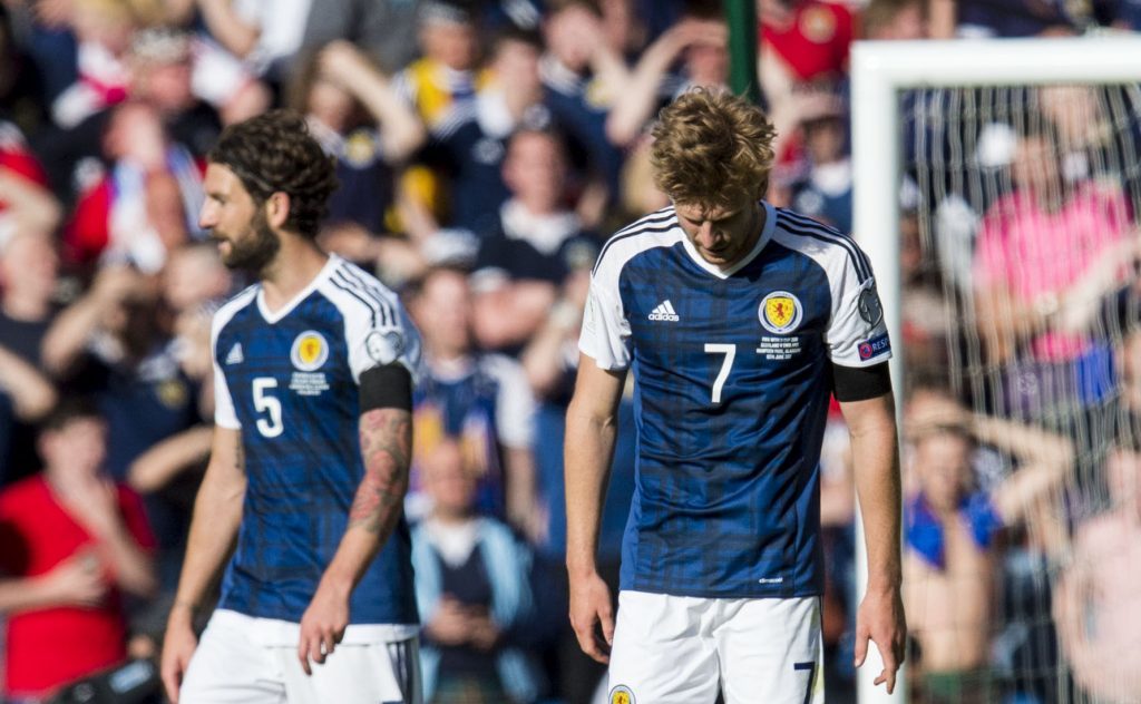 Heads bowed....Scotland after Saturday's football heartbreak.