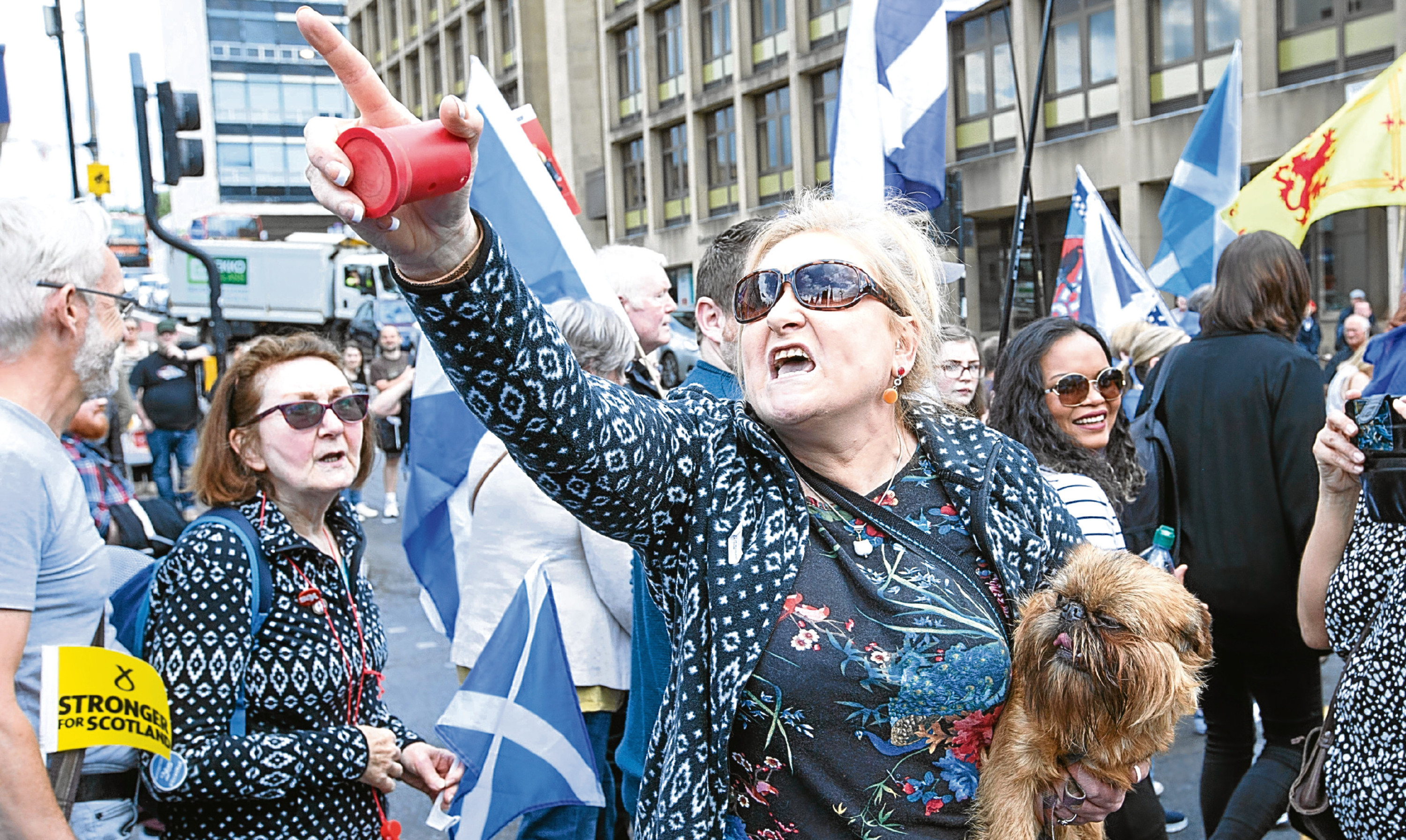 A woman gestures as Saturday’s March for Independence is met by counter demonstrators in Glasgow.