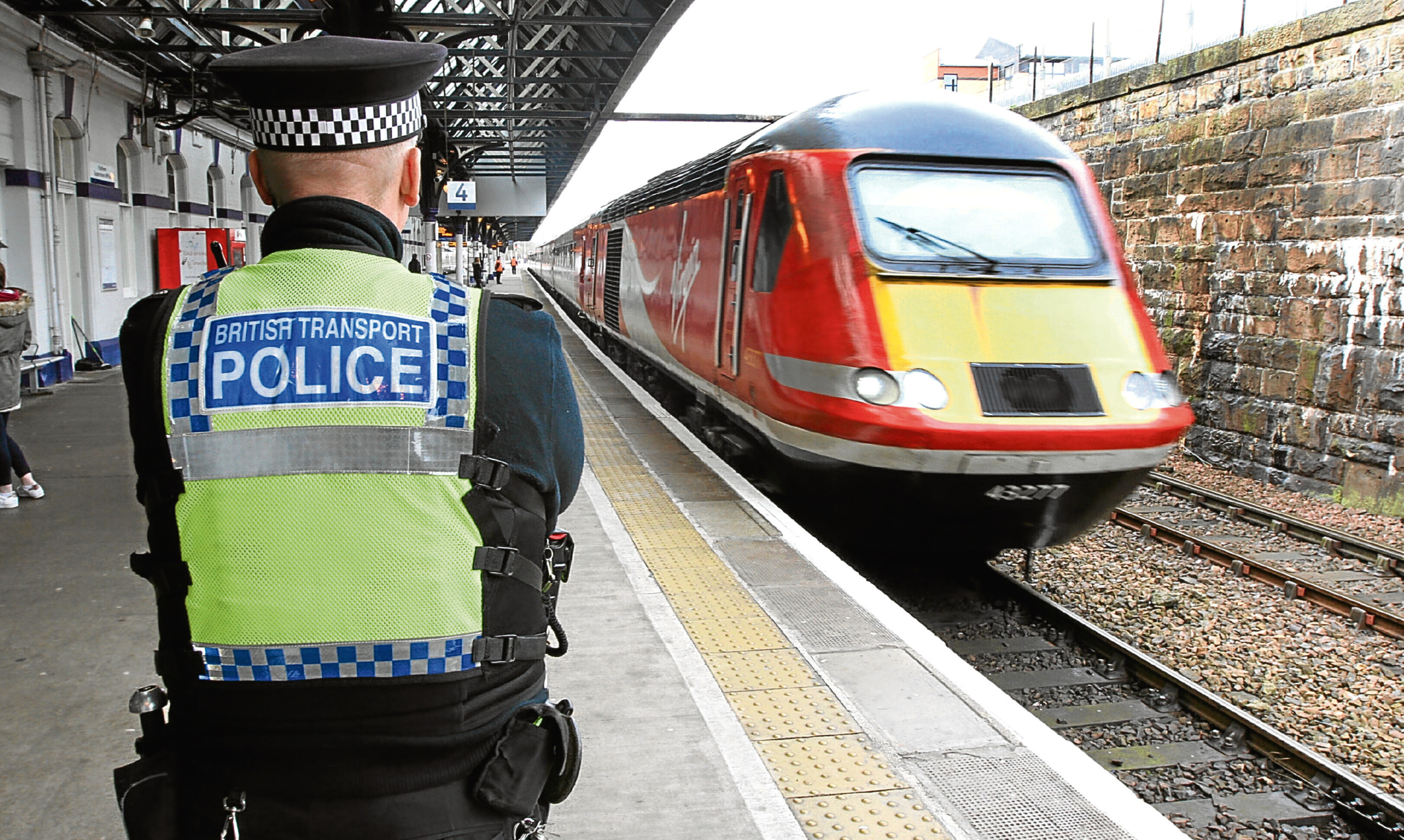 A British Transport Police officer on duty at Dundee railway station.