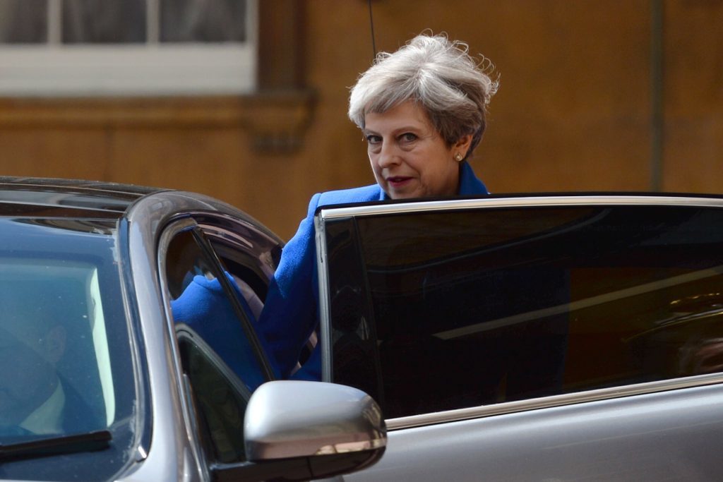 Prime Minister Theresa May with husband Philip leave Buckingham Palace after a meeting with the Queen to seek permission to form a UK government.