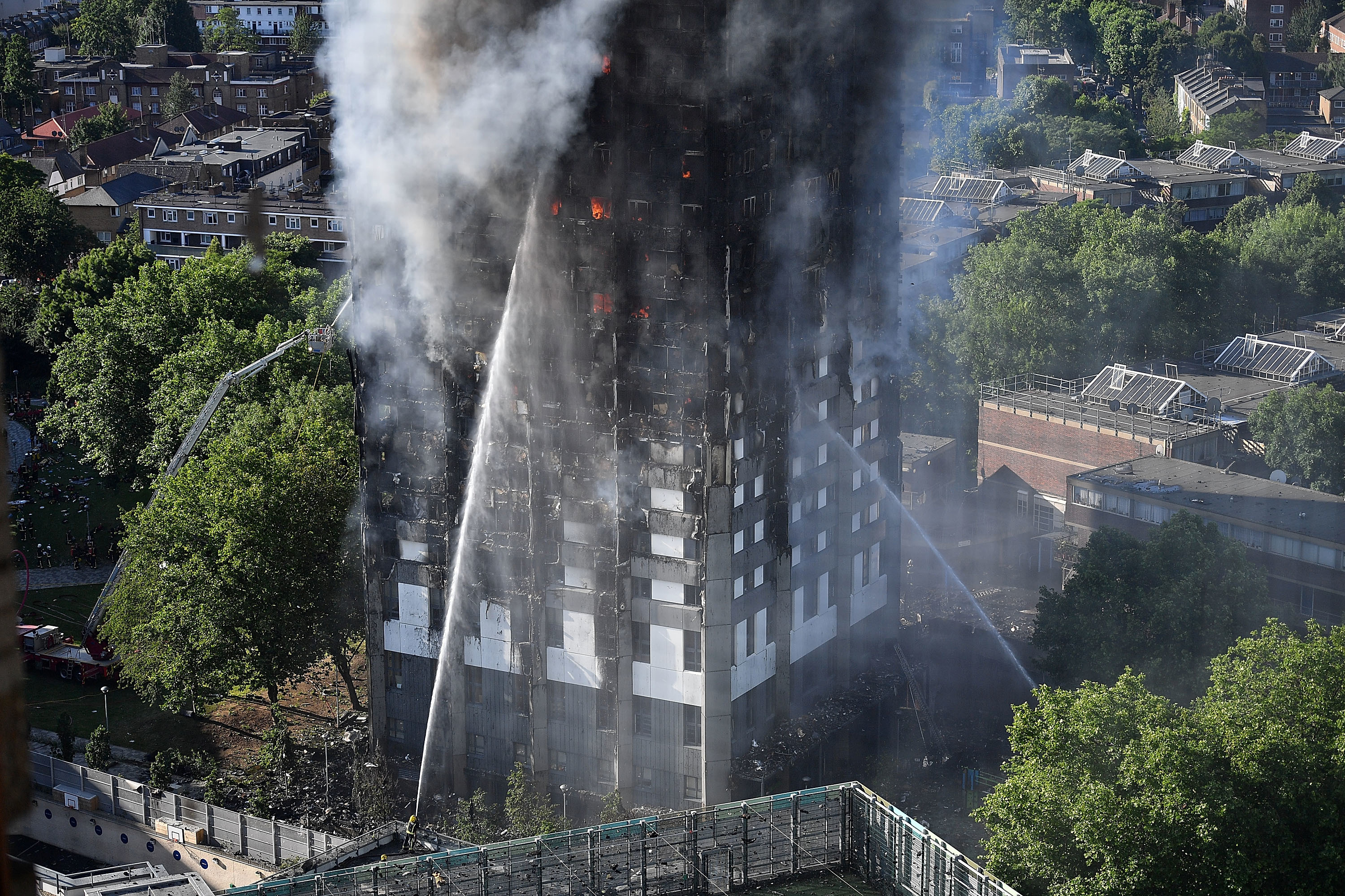 Fire fighters tackle the building after a huge fire engulfed the 24-storey Grenfell Tower in Latimer Road, West London.