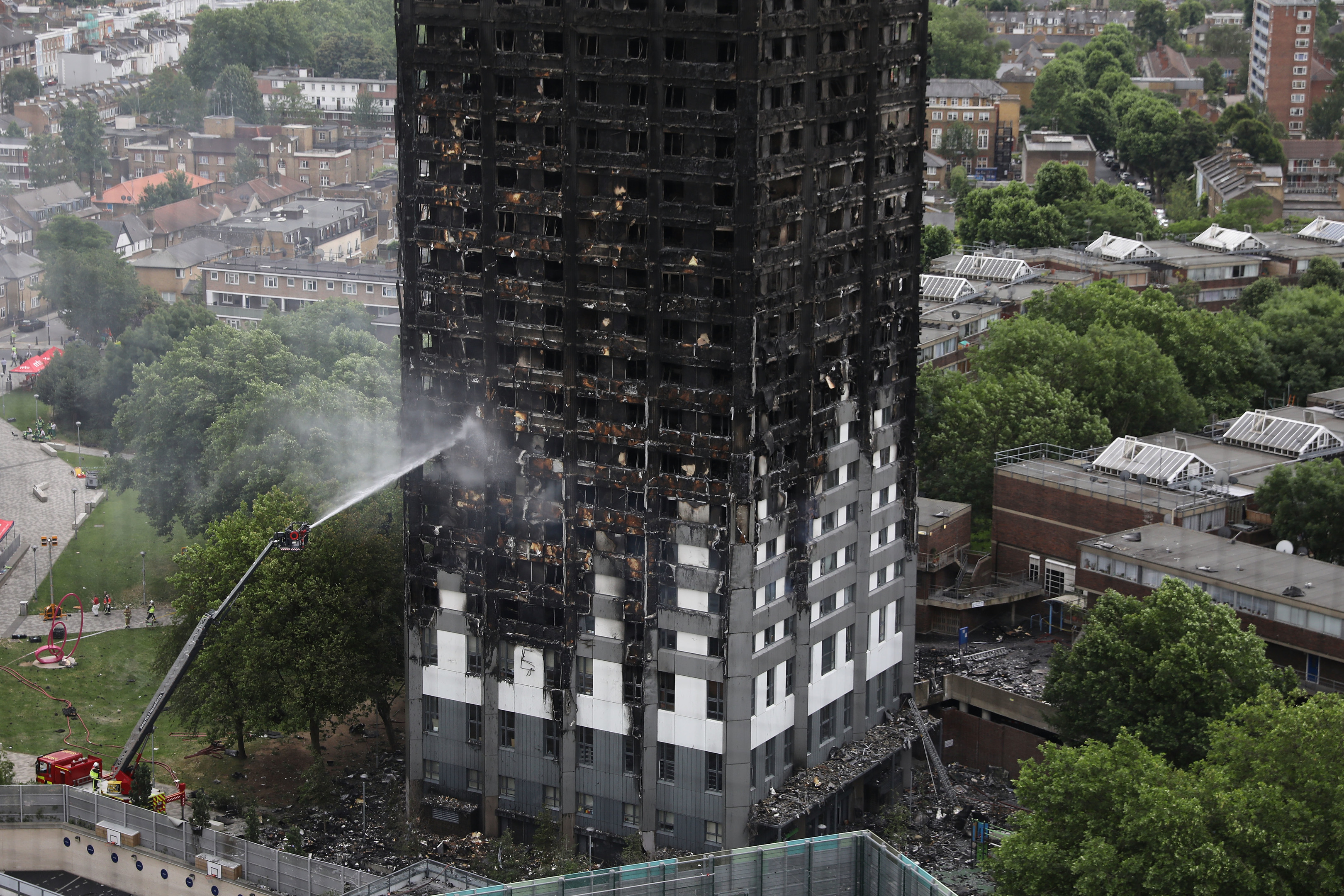 A hose dousing the fire at Grenfell Tower on June 15, 2017.