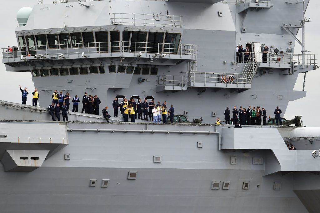 The new Royal Navy aircraft carrier HMS Queen Elizabeth departs Rosyth dockyard.