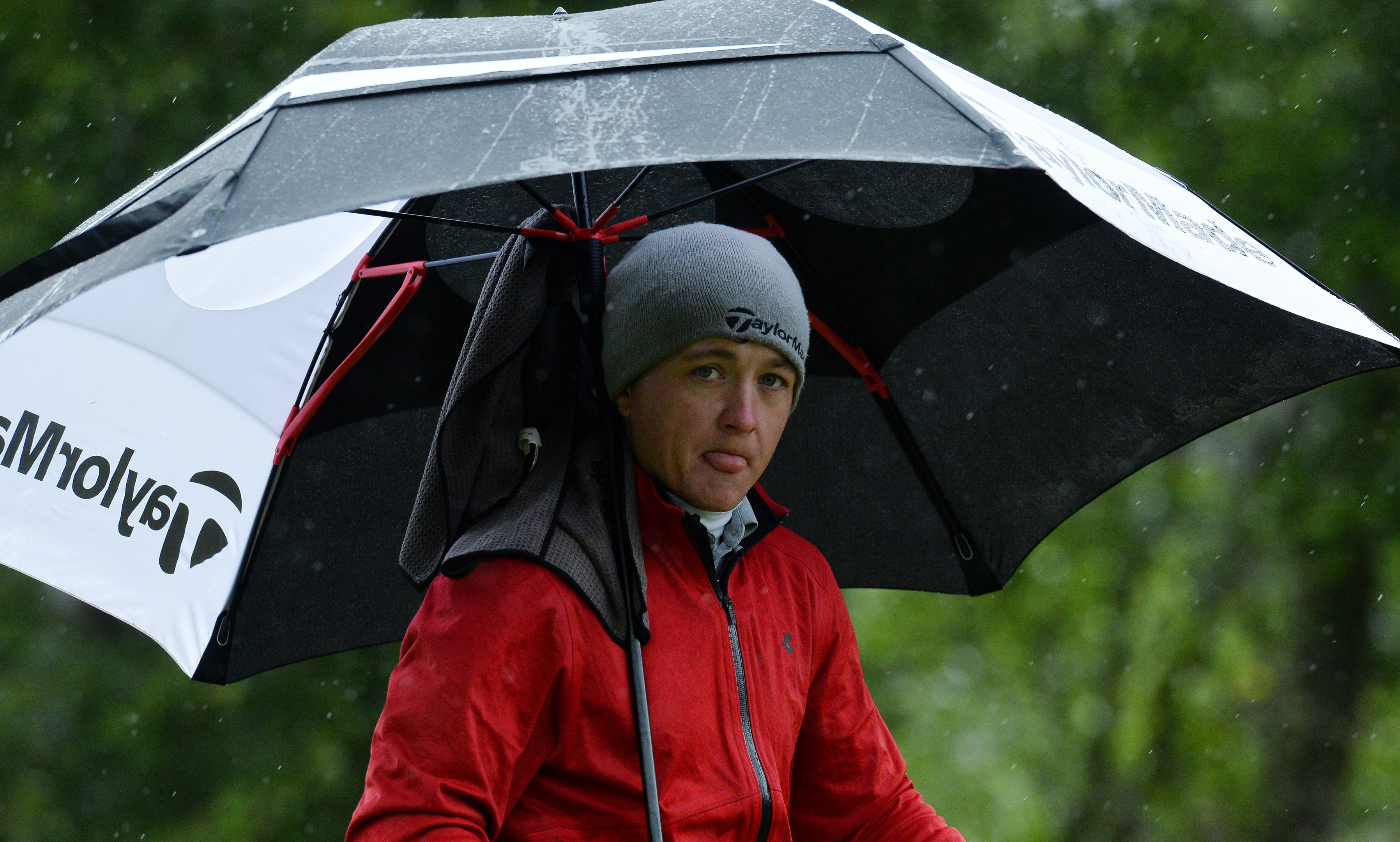 Richard James takes shelter from the wet at Soey Valley on his way to an outstanding 65 in the SSE Scottish Hydro Challenge.